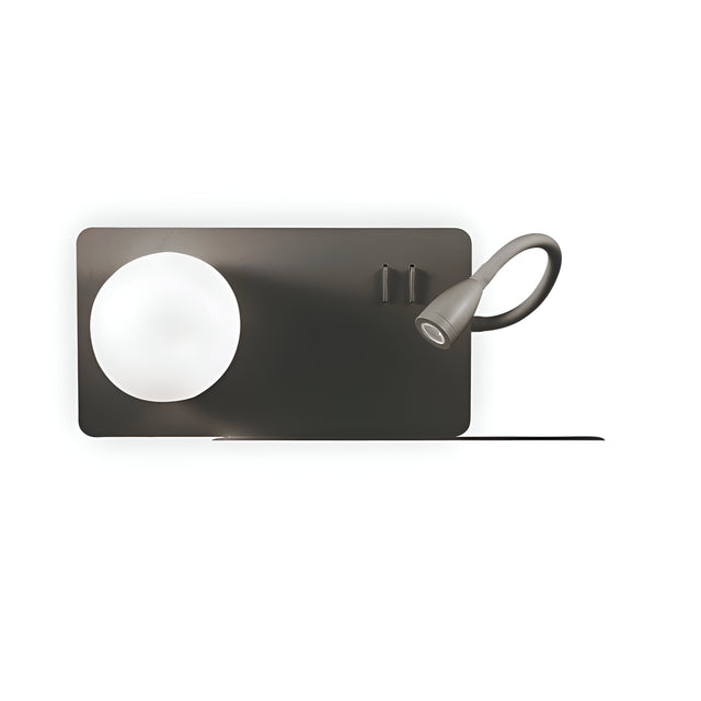 The Heritage-2 LED Wall Light - Black showcases a contemporary design with a round, white lampshade on one side and a flexible metallic reading light arm extending from the other, all mounted on a sleek black rectangular panel.