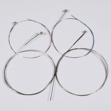 Chord VLS-1030 violin strings set, four coiled steel-core strings with coloured windings and ball ends, laid on a plain white background.
