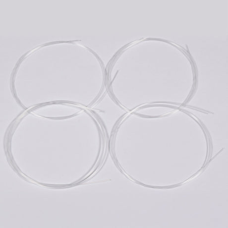 Chord UKS4-W set of four white nylon ukulele strings, coiled loosely on a plain light grey background.