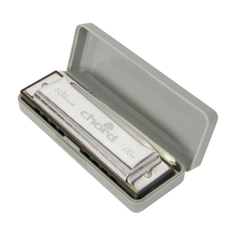 Chord Blues Ten diatonic harmonica in D with chrome cover plates and numbered holes, shown inside its open grey plastic storage case.