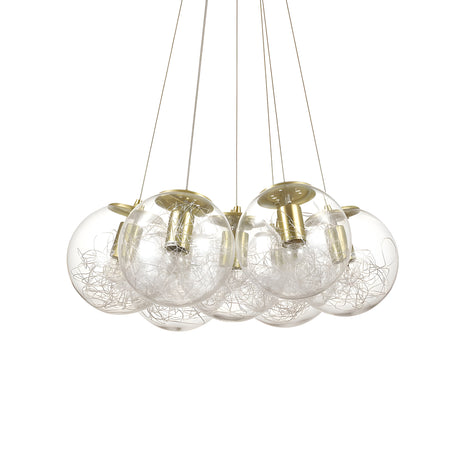 The Lyria 7 Light Cluster Pendant - Brass features a contemporary style with its seven glass spheres. Inside each sphere is a nest of silver wires, all elegantly suspended by delicate wires and highlighted by a brass finish, bringing sophistication to any room.