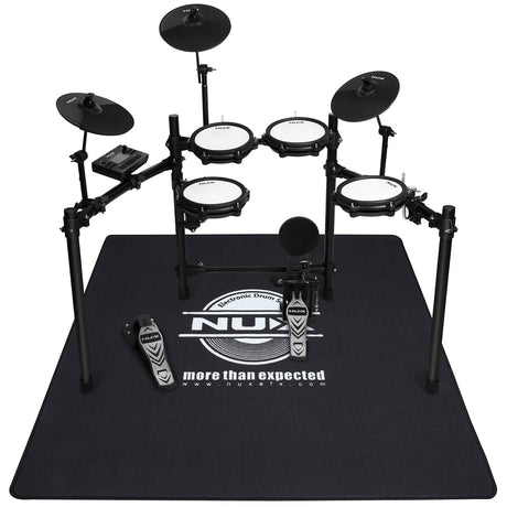 NU-X Heavy Duty Drum Rug in black with white logo, shown under a five-piece electronic drum kit with cymbals, pedals and module.