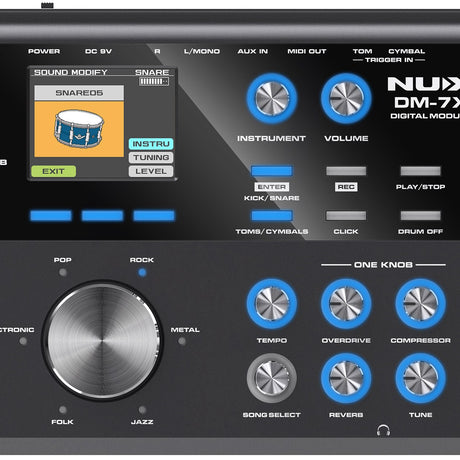 Close-up of the NU-X DM-7X digital drum module control panel with blue rotary knobs for instrument, volume, tempo, overdrive, compressor, reverb and tune.
