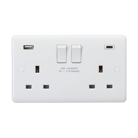 The 13A 2 Gang DP Switched Socket with Dual USB (Rounded Edge) is a white electrical wall socket made from durable thermoset resin and includes two USB ports—USB-A and USB-C. Each socket features a switch control positioned above it, with "USB CHARGER 5V 3.1A [shared]" labeled below. It combines anti-microbial properties with modern functionality to enhance safety.