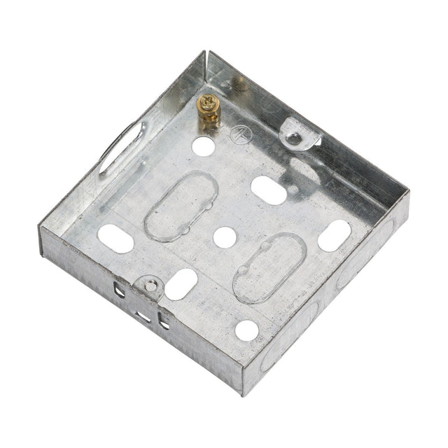 The 1 Gang 16mm Galvanised Steel Box is a rectangular metal electrical junction box designed with multiple pre-punched knockouts and a visible earth terminal. Made from galvanized steel for enhanced durability, it meets EN 60670 standards and includes a flat base with raised sides.