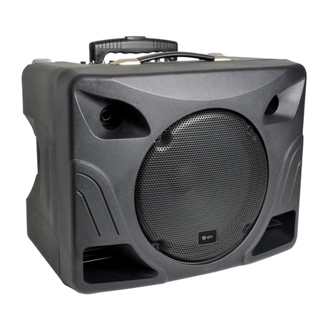 The QTX DELTA-200 Performance Portable PA Unit is a black portable PA system featuring a prominent front-facing grill, two lower slotted vents, and a convenient top handle. Its angular design is accentuated by gentle curves and discreet branding near the center of the grill. Additionally, it includes a Bluetooth receiver for seamless connectivity.