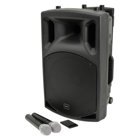The QTX QX12PA-PLUS Portable PA system is equipped with a large black speaker featuring a mesh front panel. It comes with UHF wireless microphones and Bluetooth connectivity, ensuring versatile use. The design includes a handle for easy transportation, top ports for accessibility, and it also features a small remote control for added convenience.