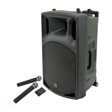 QTX QX15PA portable PA speaker in black with wheels, carry handle, front grille, two wireless microphones and remote, shown on a white background.
