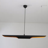 The Stealth 2 Light Linear Suspension in Brass & Black features a sleek modern design with a black horizontal shade and subtle orange glow, suspended from a black cord against a white ceiling for minimalist elegance.