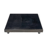 Modena Polished Black Granite parasol base, square, 8cm-thick slab with glossy black finish, mounting holes on top, and castor wheels on a plain white background.