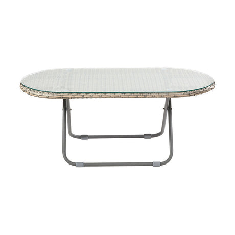 Tobs oval outdoor lounger table with grey synthetic rattan edge, glass top, and folding grey metal legs, shown on a plain white background.