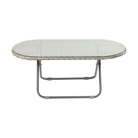 Tobs oval outdoor lounger table with grey synthetic rattan weave, glass top, and tubular grey metal legs, shown on a plain white background.