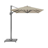 Voyager T1 X rectangular cantilever parasol in champagne with grey aluminium pole and side arm, on a wheeled dark granite base, shown against a plain white background.