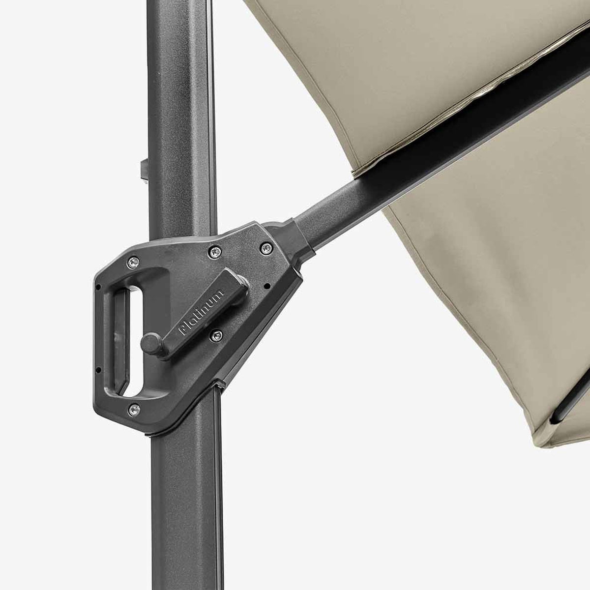 Close-up of the Voyager T1 X cantilever parasol's tilt mechanism and hinge joint in dark grey metal, with champagne canopy fabric visible above against a plain background.