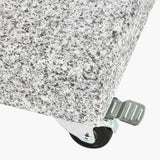 Close-up of the Salerno Hammered Grey 40KG Wheeled Parasol Base corner, showing a speckled grey finish, chrome castor wheel, and metal clip fastening on a white background.