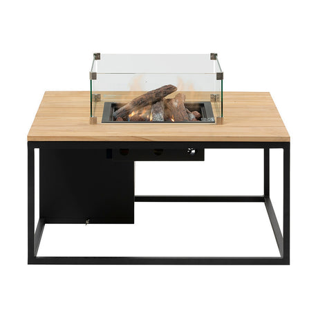 Cosi Black & Teak Gas Fire Pit Table, 100cm, with square teak-effect wood top, black metal frame, glass wind guard, and stainless steel burner with log set, shown on a white background.