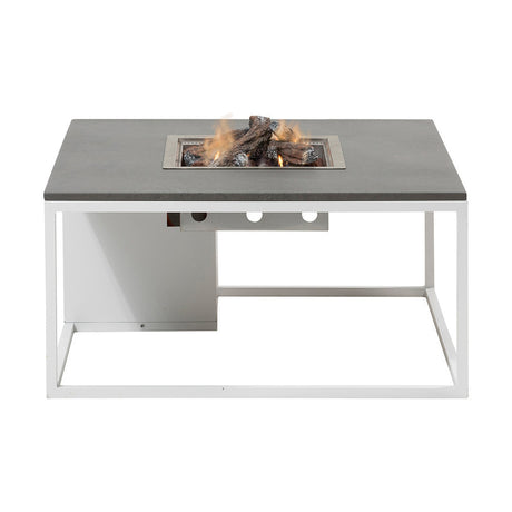 Cosi White & Grey Gas Fire Pit Table, 100cm, with grey tabletop, white metal frame, and stainless steel burner insert holding lit ceramic logs, shown on a plain white background.
