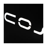 Close-up of the Cosi Cover Plate for Large Glass Set, 52cm, showing white lettering on a black surface against a plain dark background.