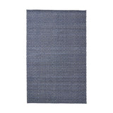 Rectangular indoor outdoor rug in denim blue and white with a small-scale diamond ikat pattern, shown flat against a plain white background.