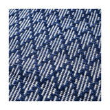 Close-up of the Indoor Outdoor Denim Blue & White Ikat Design Rug, showing a woven zigzag pattern in navy blue and white polyester.