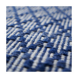 Close-up of the Indoor Outdoor Denim Blue & White Ikat Design Rug, 230 x 160cm, showing its woven polyester texture with a geometric diamond pattern in denim blue and white.