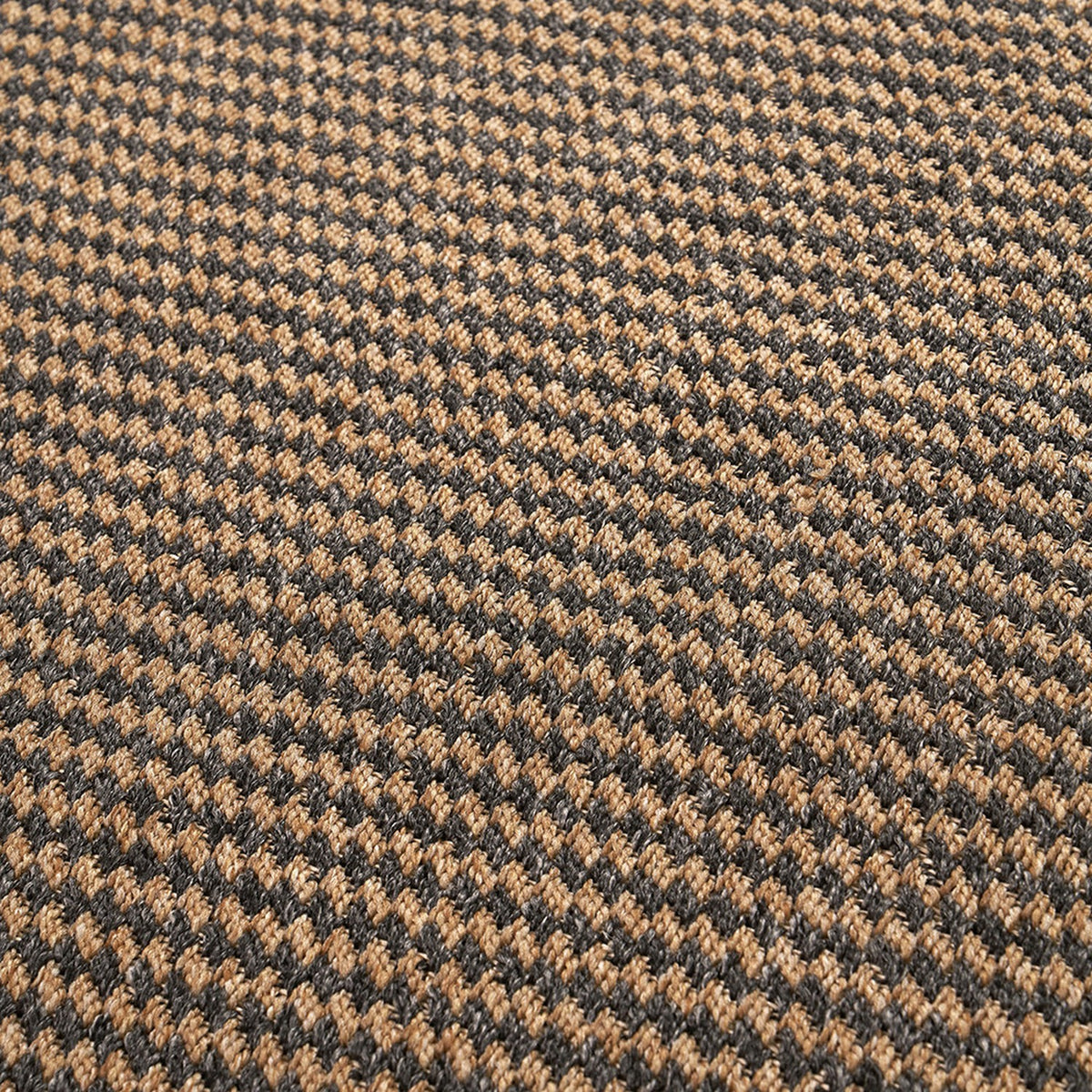 Close-up of the Indoor Outdoor Natural & Slate Grey Design Rug, 230 x 160cm, showing a tight woven houndstooth-style pattern in tan and charcoal polypropylene fibre.