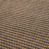Close-up of the Indoor Outdoor Natural & Slate Grey Design Rug, 230 x 160cm, showing a tight woven houndstooth-style pattern in tan and charcoal polypropylene fibre.