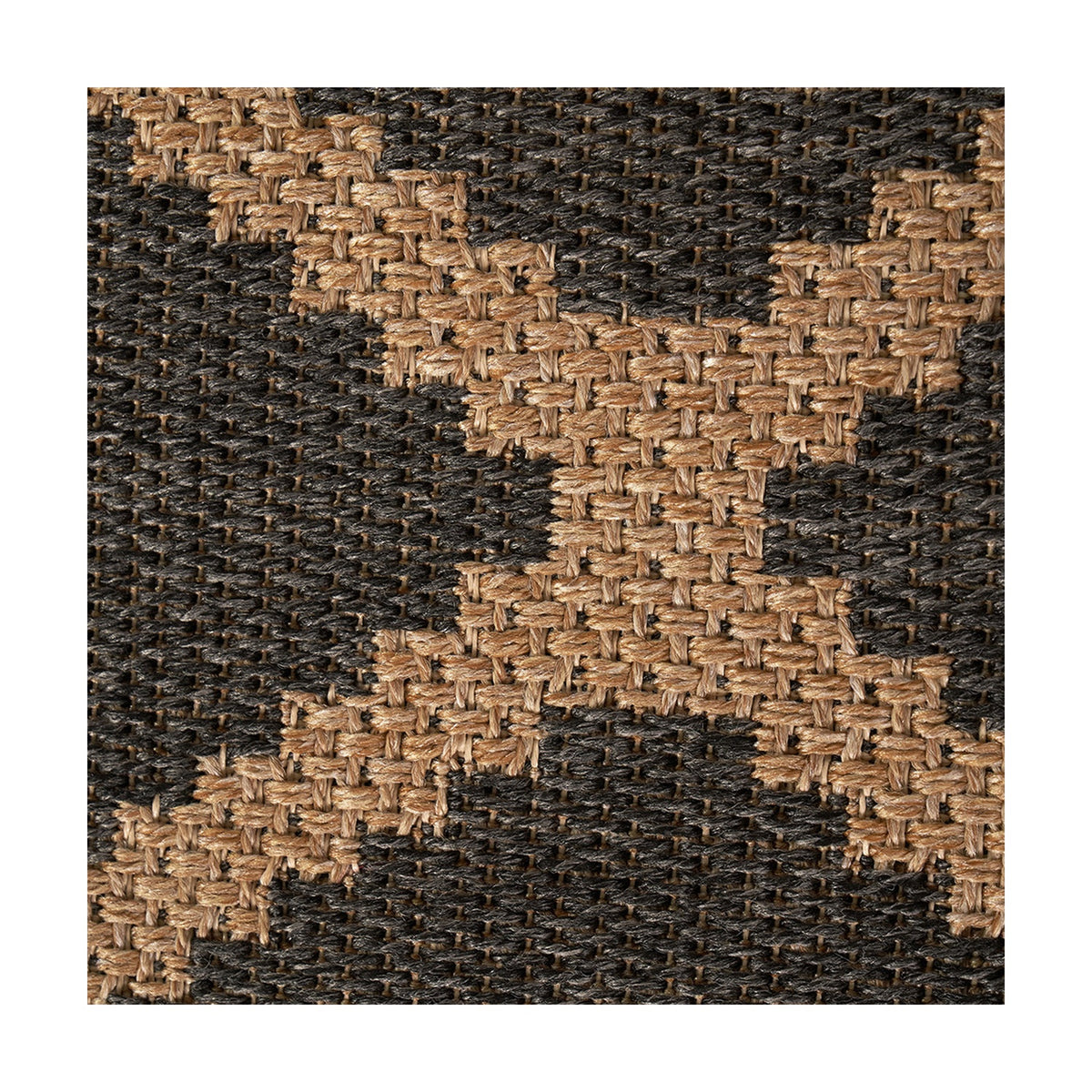 Close-up of an indoor outdoor rug with a diamond weave pattern in natural tan and slate grey polypropylene fibre, showing detailed woven texture.