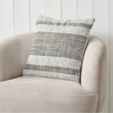 Indoor Outdoor Steel Grey & White Stripe Design Scatter Cushion on a beige upholstered armchair, woven fabric with horizontal grey and white stripes.