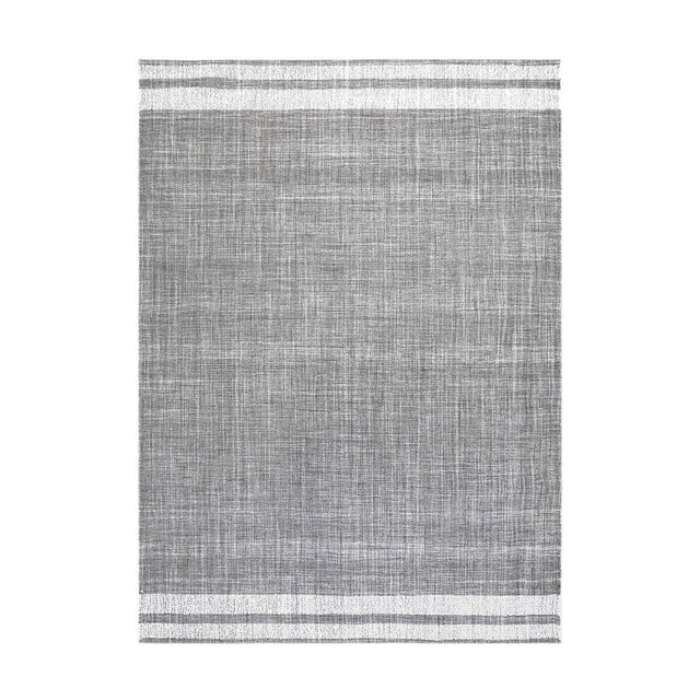 Indoor outdoor rug in steel grey with white striped borders top and bottom, woven fabric texture, shown on a plain white background.