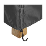 Close-up of the Firetable Aerocover, an anthracite fabric outdoor cover with a stitched seam and drawcord toggle fastened around a wooden table leg.