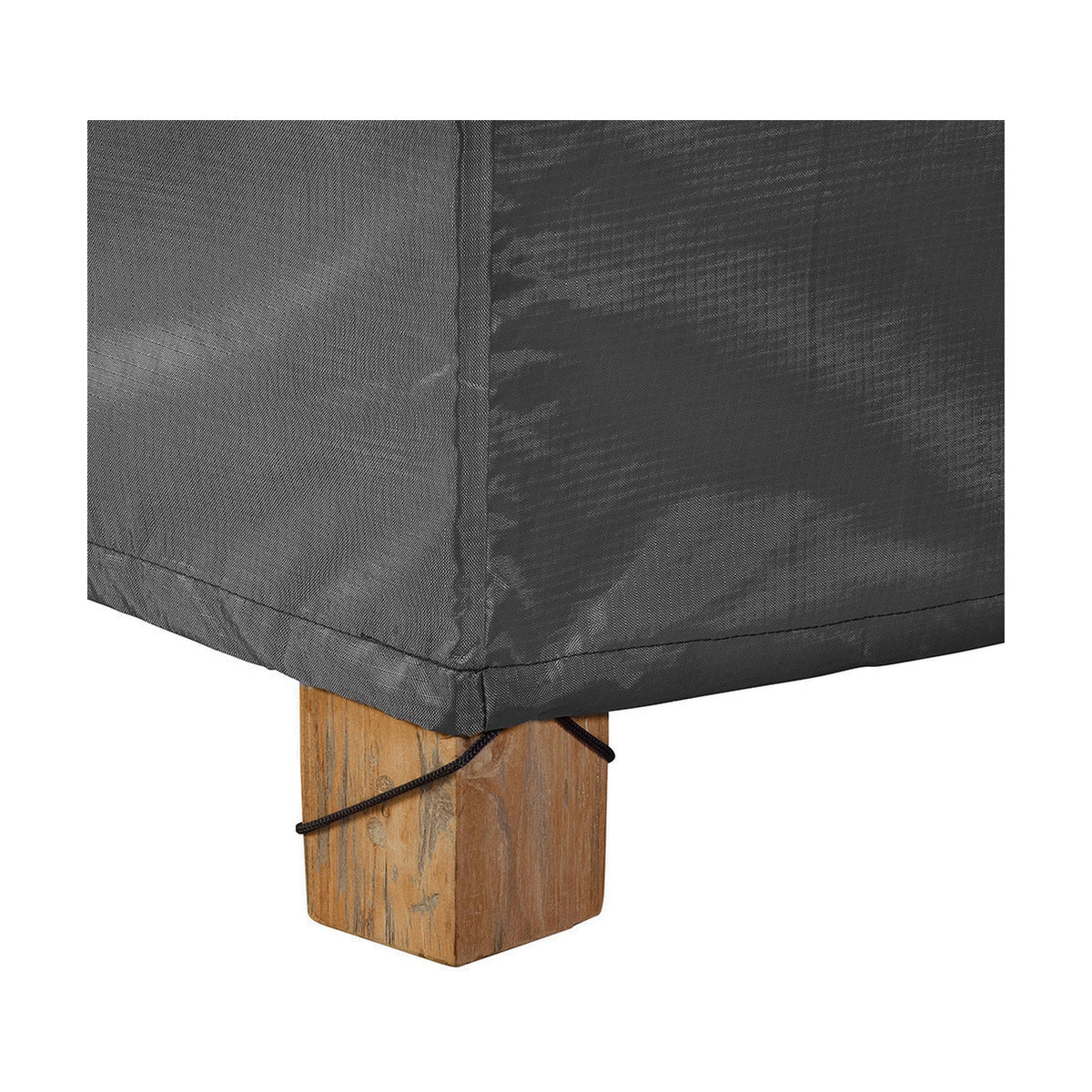 Close-up of the Firetable Aerocover, 84 x 64cm, in anthracite fabric fitted over a wooden furniture leg, showing corner seam and drawstring toggle detail.
