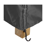 Close-up of the Firetable Aerocover, 110 x 84cm, in anthracite fabric with a corner drawstring toggle cinched around a wooden table leg on a plain white background.