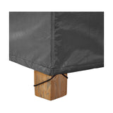 Close-up of the Firetable Aerocover, 112 x 82cm, in anthracite polyester fabric, showing a corner seam secured with a cord toggle around a wooden furniture leg.