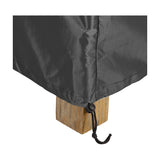 Close-up of the Firetable Aerocover, 72 x 72cm, in anthracite fabric with a stitched seam and drawstring toggle secured around a wooden furniture leg on a white background.