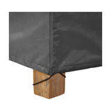 Close-up of the Firetable Aerocover, 72 x 72cm, in anthracite polyester with a drawstring corner secured around a wooden block foot.