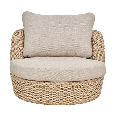 Kampala Outdoor Lounge Chair with round woven wicker base, beige cushioned seat and rectangular bolster back cushion, shown on a plain white background.