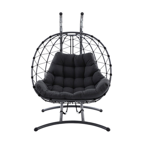 Lyon anthracite hanging egg chair with woven wire frame, dark cushioned seat, and metal stand with hooks, shown on a plain white background.