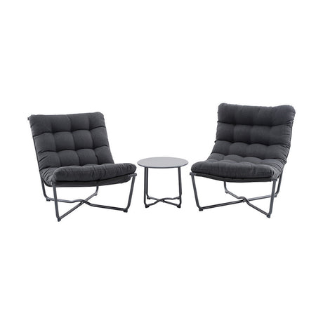 Clermont Anthracite Outdoor Lounging Set: two low-slung tufted lounge chairs with dark grey cushions on crossed metal frames, paired with a round grey side table, on a plain white background.