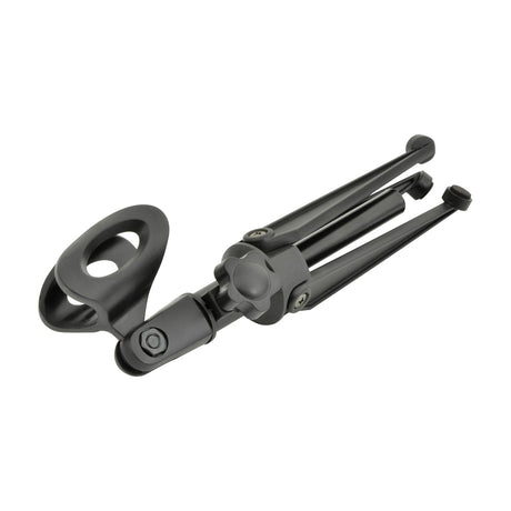 QTX DMS-01 desktop microphone tripod stand by AVSL shown folded flat with black plastic mic clip and rubber-footed legs on a white background.