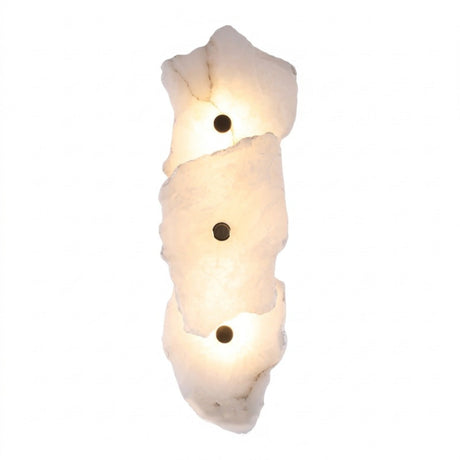 Frammenta LED 3 Light Fragment Alabaster Wall Light with brass bosses, three stacked raw-edged alabaster slabs glowing softly against a plain white background.