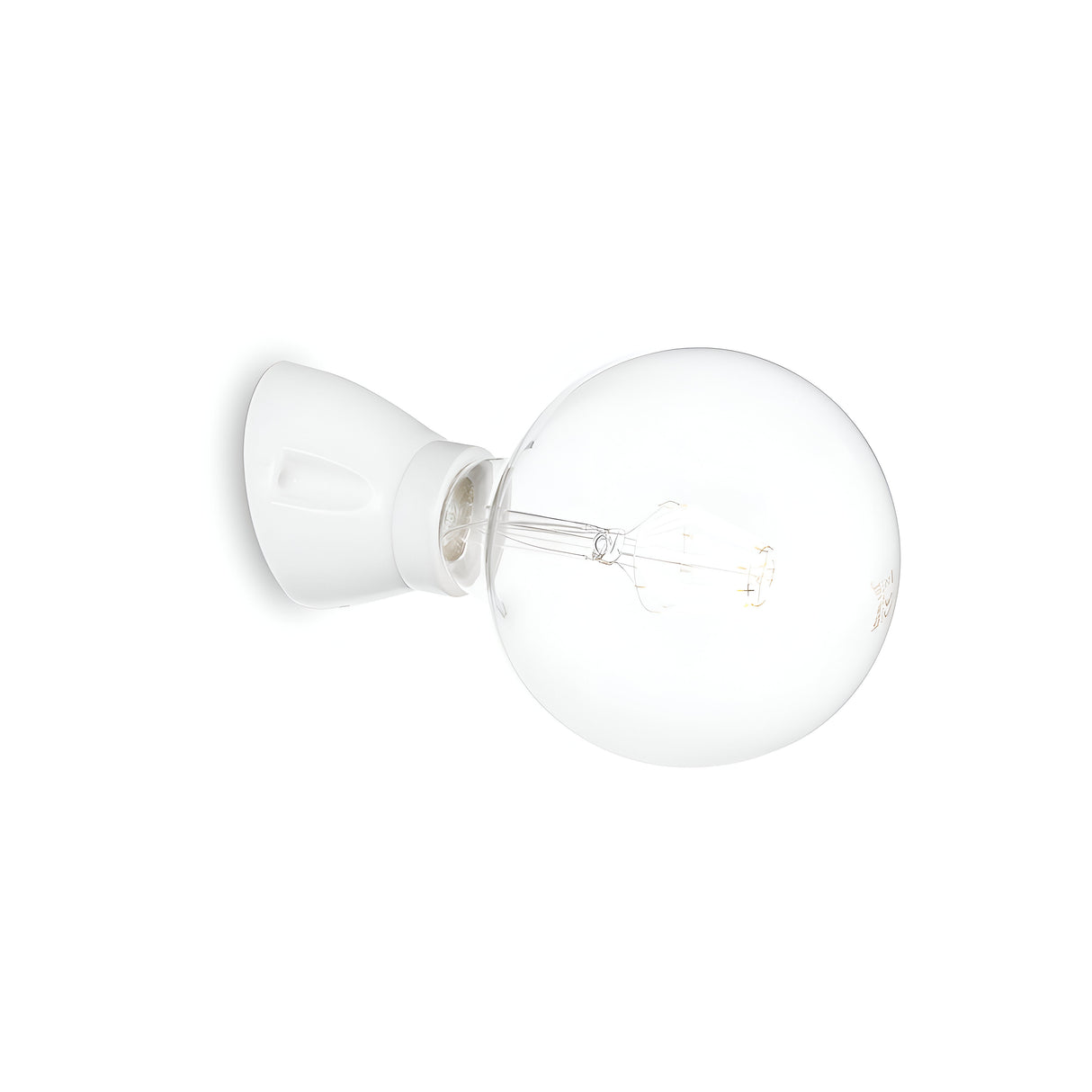 The Prismis Wall Light - White, featuring a clear glass bulb with a visible filament and mounted on a minimalist white ceramic socket, is displayed against a plain white background. The bulb is positioned horizontally to give a side view of this contemporary fixture.