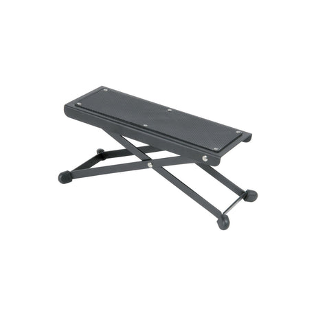 Chord FR1 Adjustable Guitarist Footrest by AVSL with black metal folding X-frame and rubber-padded foot plate, shown on a plain white background.