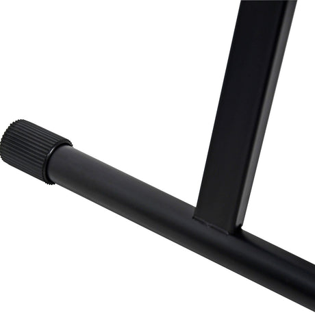 Close-up of the Chord double X-frame keyboard stand by AVSL, showing the matte black steel support arm with textured end cap and tooth lock detail.