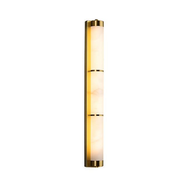 The Arelis LED Vertical Alabaster Wall Light features a long, three-section frosted shade with brushed brass bands, mounted vertically in a soft white finish.