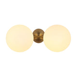 The Vetra 2 Light Opal Glass Wall/Semi-Flush Ceiling Light in Gold features two frosted glass globes on a gold base, offering warm, modern illumination and adding contemporary style to any room.
