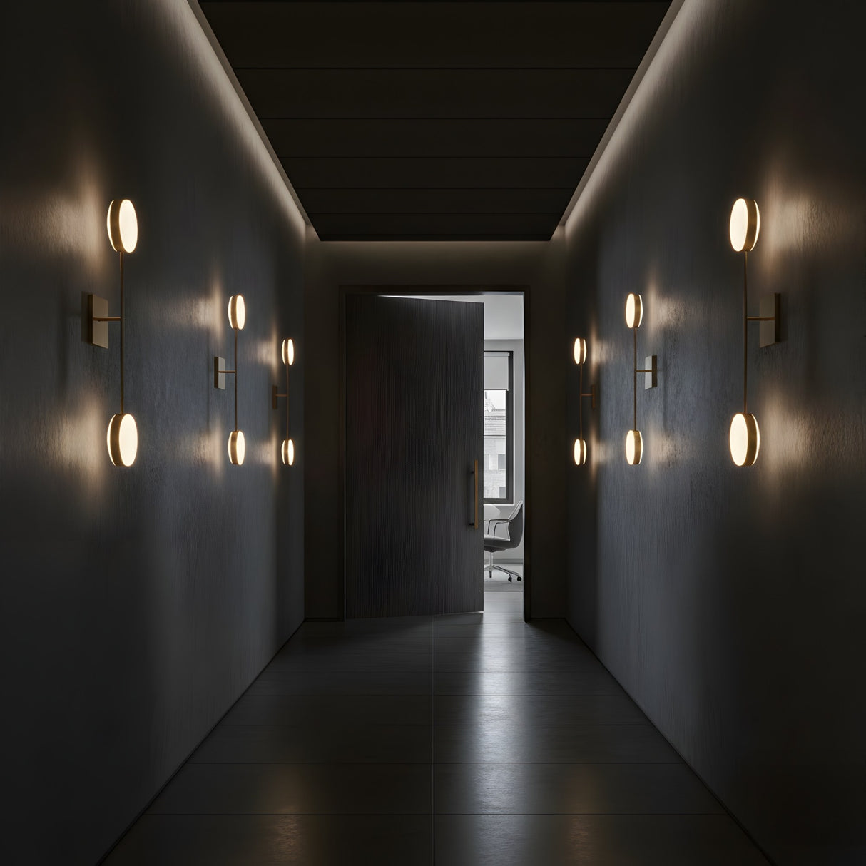 A dimly lit hallway features Marvello LED Twin Sphere Alabaster Wall Lights in soft white and brushed brass on both sides, leading to an open door that reveals a bright office with a desk and chair in the background.