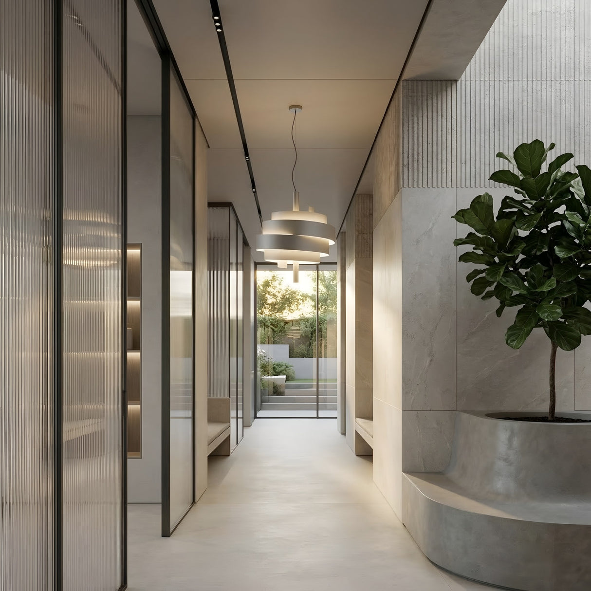 A modern hallway with minimalist decor features smooth light gray floors and walls, glass partitions, a built-in planter with a tall leafy plant, and Picasso Pendant Light - White fixtures hanging from the ceiling as sunlight streams in through large windows.