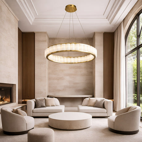 A modern, elegant living room with cream sofas and chairs, a round coffee table, floor-to-ceiling window, light beige walls, and the Orion 36 Light Ring Alabaster Chandelier in soft white & brushed brass hanging from the high ceiling.