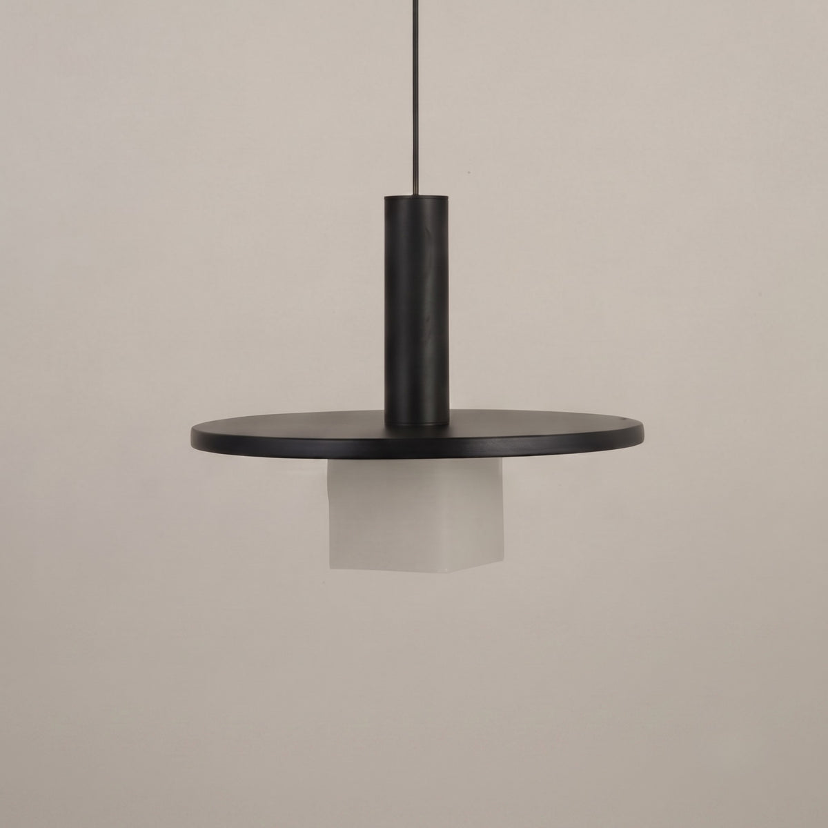 Norevia Cube Alabaster Pendant Light in matte black, featuring a wide disc canopy, slim stem, and square alabaster shade, shown against a plain neutral background.